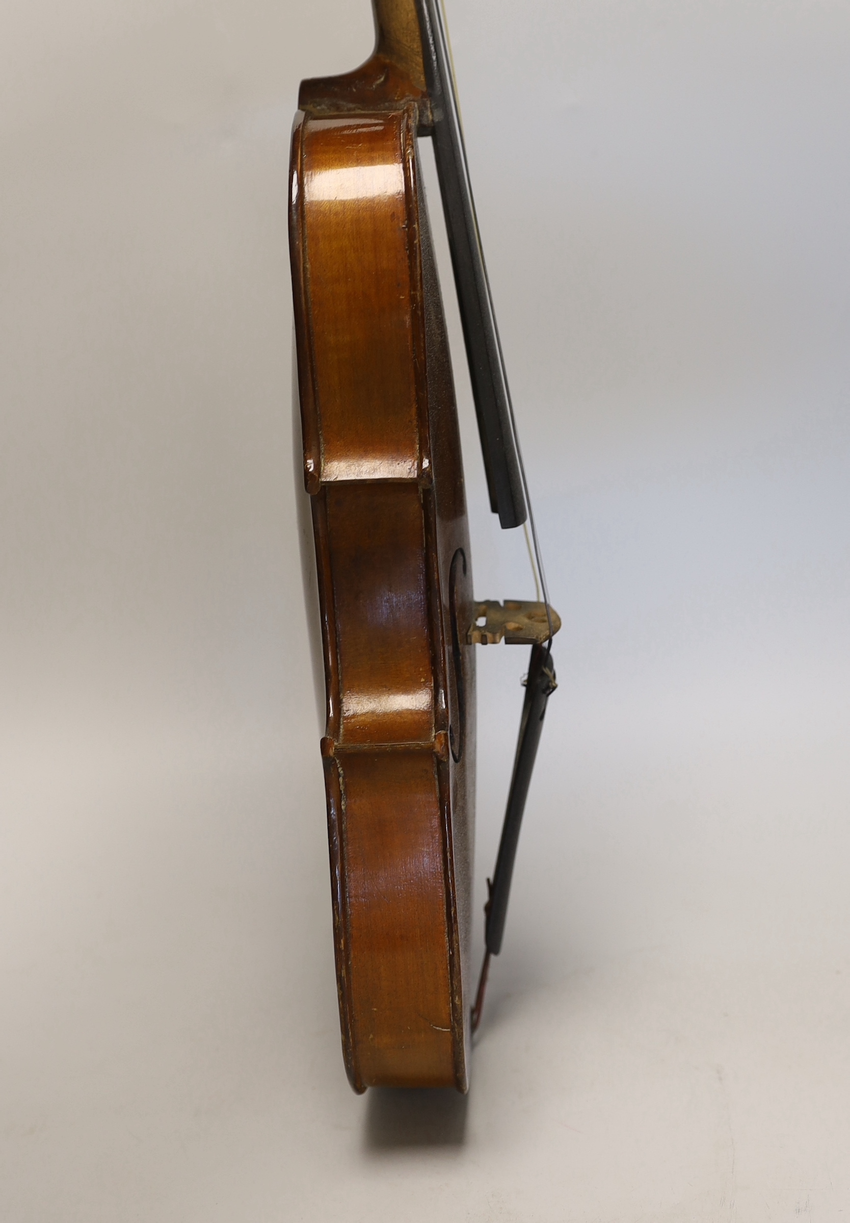 A three quarter size German violin, in case violin 56cm long